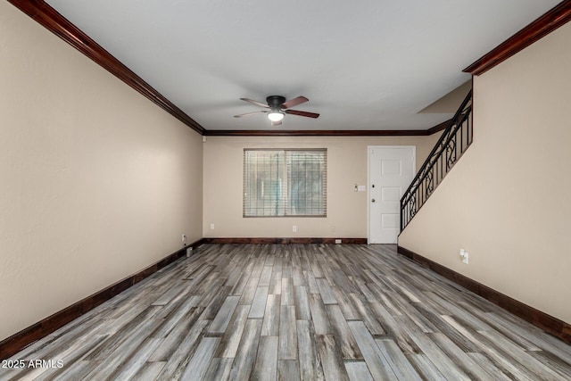 7126 N 19th Ave Unit 228, Phoenix, AZ 85021 - unfurnished living room featuring ceiling fan, wood finished floors, ornamental molding, and stairs