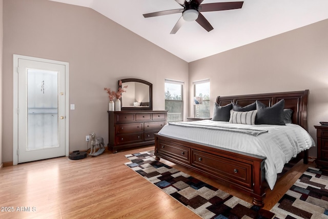 bedroom featuring lofted ceiling, light hardwood / wood-style floors, and ceiling fan