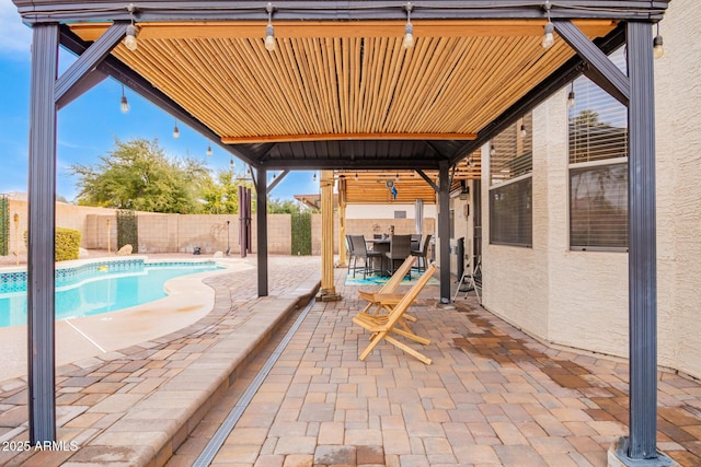 view of patio / terrace featuring outdoor dining area, a fenced backyard, and a fenced in pool