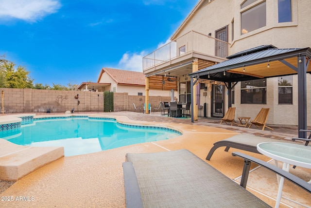 view of swimming pool with a gazebo, a patio area, a fenced backyard, and a fenced in pool