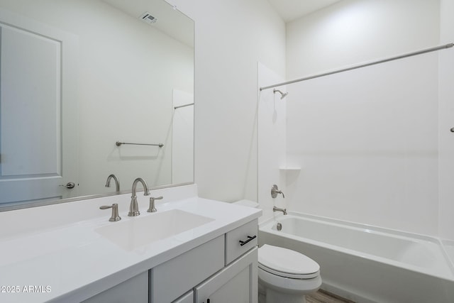 full bath with visible vents, toilet, vanity, and  shower combination