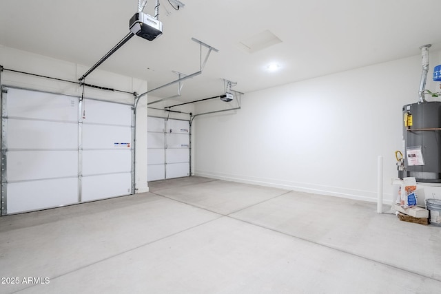 garage with water heater, a garage door opener, and baseboards