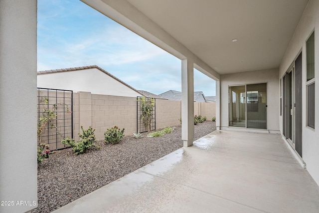 view of patio / terrace featuring fence