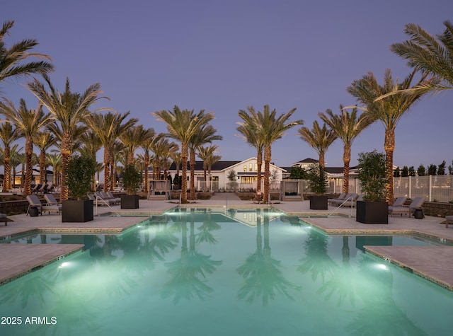 pool featuring a patio and fence