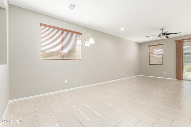 9822 W Caron Dr, Peoria, AZ 85345 - empty room with a chandelier, baseboards, a ceiling fan, and recessed lighting