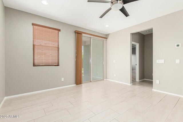 9822 W Caron Dr, Peoria, AZ 85345 - unfurnished bedroom featuring access to exterior, recessed lighting, baseboards, and a ceiling fan