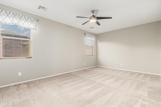 9822 W Caron Dr, Peoria, AZ 85345 - empty room with light colored carpet, a ceiling fan, and baseboards