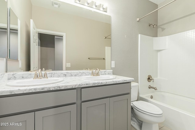 9822 W Caron Dr, Peoria, AZ 85345 - full bathroom with double vanity, toilet, and shower / bathtub combination