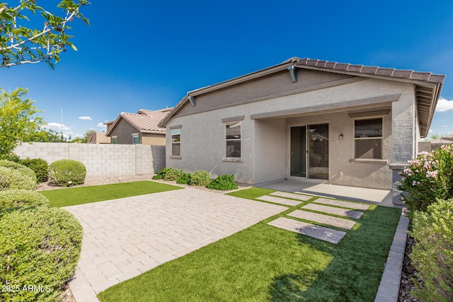 9822 W Caron Dr, Peoria, AZ 85345 - back of house featuring a patio area, stucco siding, and a tiled roof