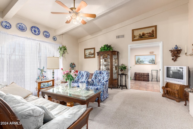 carpeted living room featuring vaulted ceiling with beams and ceiling fan