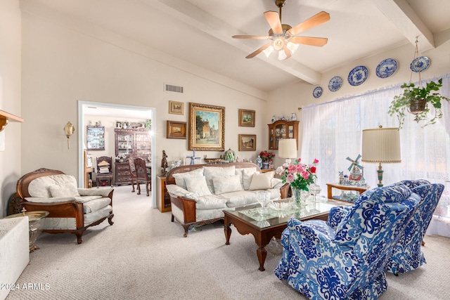 carpeted living room featuring ceiling fan and vaulted ceiling with beams