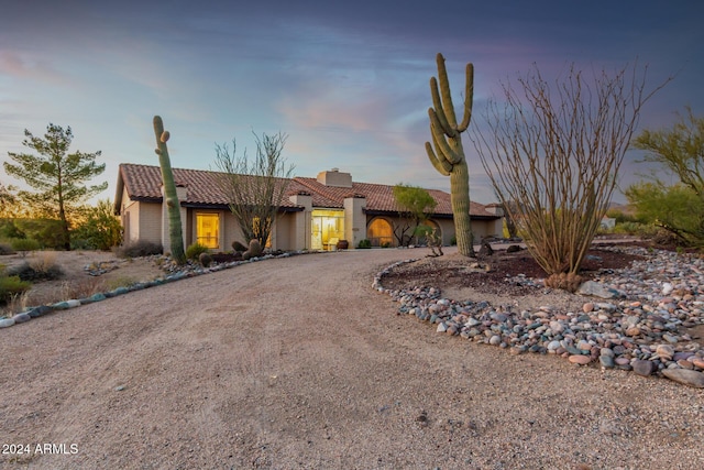 36444 N Stardust Ln, Carefree, AZ 85377 - view of front of home with a tile roof, stucco siding, and curved driveway
