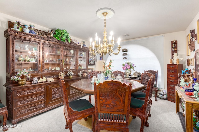 carpeted dining room with an inviting chandelier