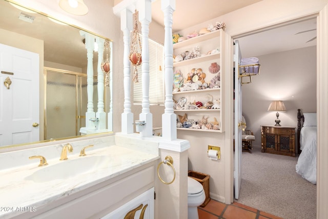 36444 N Stardust Ln, Carefree, AZ 85377 - full bath featuring a shower stall, toilet, vanity, tile patterned flooring, and ensuite bath