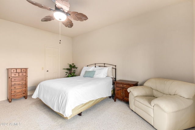 bedroom featuring light carpet and ceiling fan