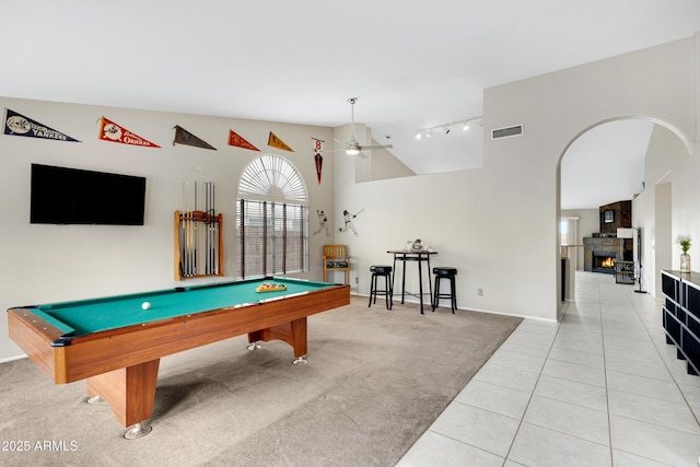 4329 W Electra Ln, Glendale, AZ 85310 - recreation room featuring rail lighting, billiards table, light tile patterned floors, a lit fireplace, and high vaulted ceiling