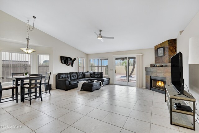 4329 W Electra Ln, Glendale, AZ 85310 - living room featuring vaulted ceiling, a ceiling fan, light tile patterned floors, and a fireplace