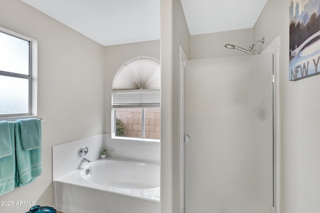 4329 W Electra Ln, Glendale, AZ 85310 - bathroom featuring a stall shower, a garden tub, and healthy amount of natural light