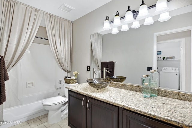 4329 W Electra Ln, Glendale, AZ 85310 - full bathroom with washer / clothes dryer, vanity, toilet, shower / bathtub combination with curtain, and tile patterned floors