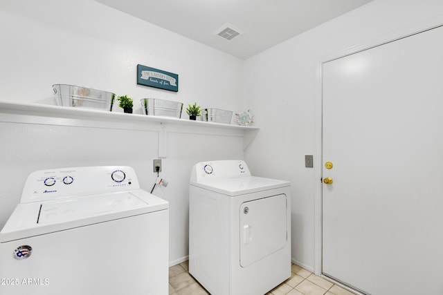 4329 W Electra Ln, Glendale, AZ 85310 - laundry area with washer and clothes dryer, light tile patterned floors, and baseboards