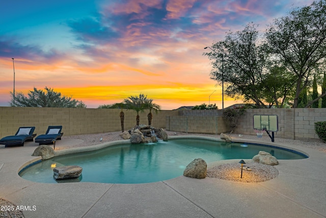 4329 W Electra Ln, Glendale, AZ 85310 - pool at dusk featuring a fenced backyard and a patio