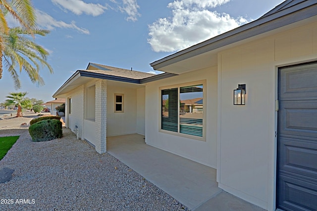 entrance to property with a patio area