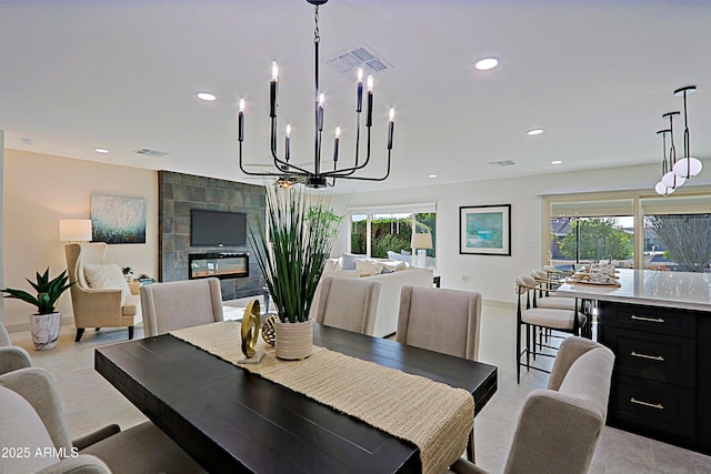 dining area featuring a wealth of natural light, a tile fireplace, visible vents, and recessed lighting