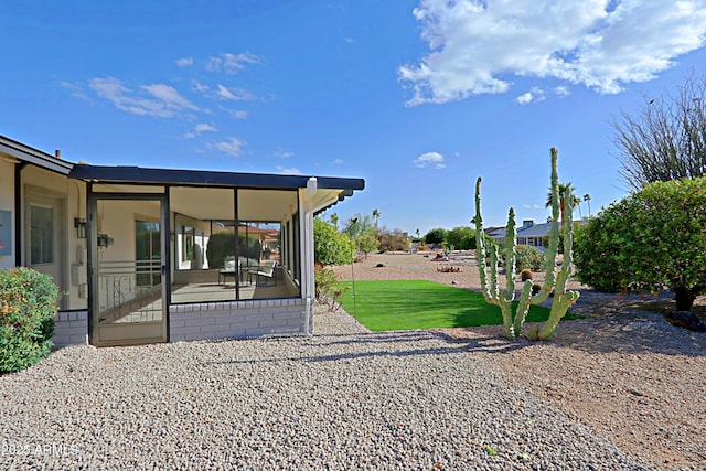 view of yard with a sunroom