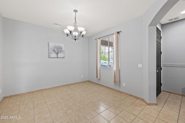 spare room with visible vents, a chandelier, and light tile patterned flooring