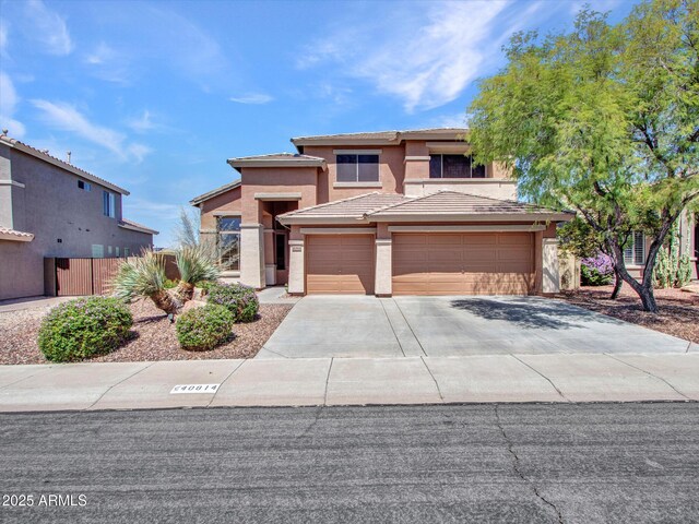 40814 N Majesty Ct, Anthem, AZ 85086 - view of front of property with stucco siding, concrete driveway, a garage, and a tiled roof