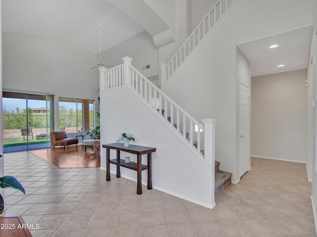 40814 N Majesty Ct, Anthem, AZ 85086 - stairway with ceiling fan, tile patterned flooring, high vaulted ceiling, arched walkways, and recessed lighting