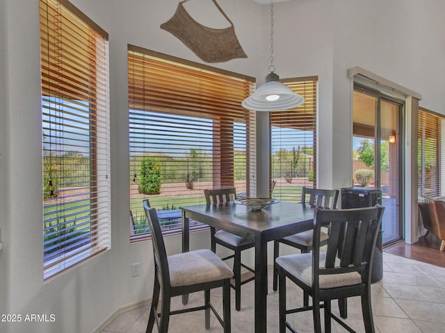 40814 N Majesty Ct, Anthem, AZ 85086 - dining area featuring light tile patterned floors and a high ceiling
