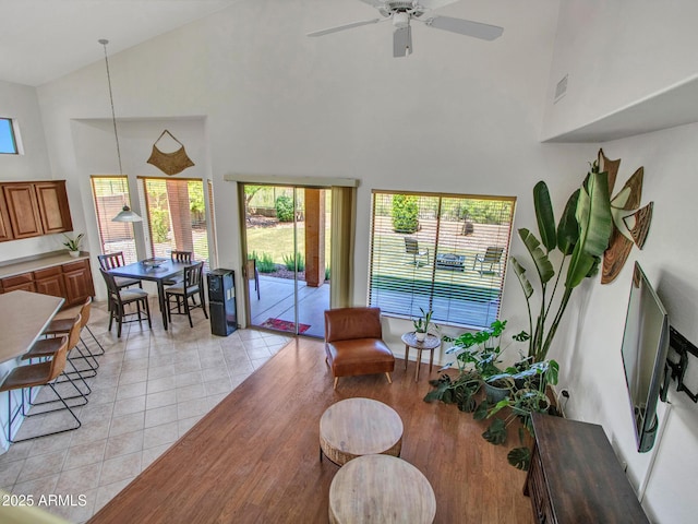 40814 N Majesty Ct, Anthem, AZ 85086 - living area featuring high vaulted ceiling, a ceiling fan, and light tile patterned floors
