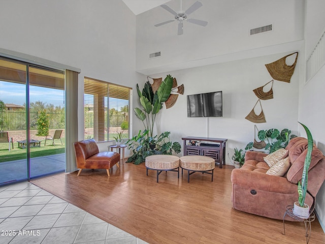 40814 N Majesty Ct, Anthem, AZ 85086 - living area with high vaulted ceiling, a ceiling fan, and light wood-style floors