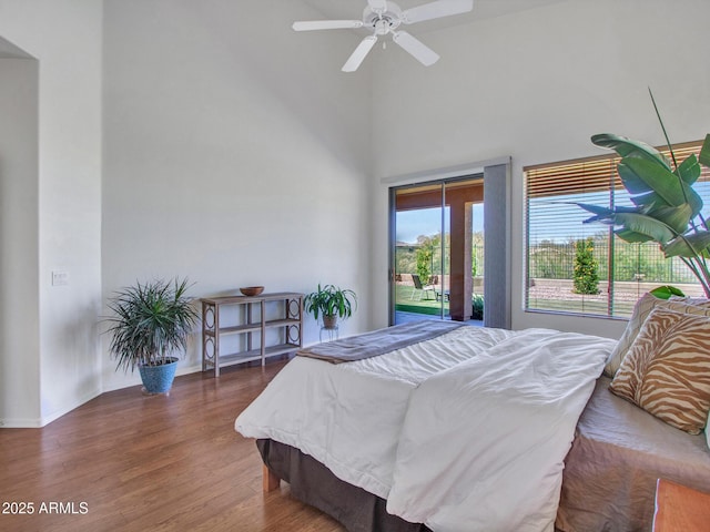 40814 N Majesty Ct, Anthem, AZ 85086 - bedroom featuring access to exterior, wood finished floors, and a high ceiling