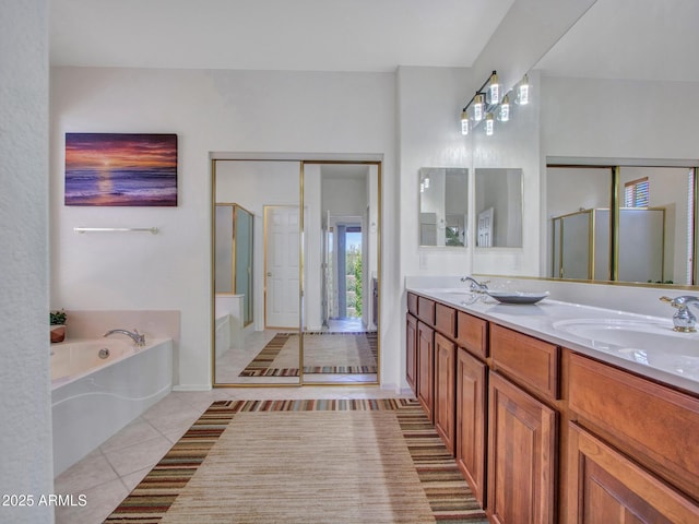 40814 N Majesty Ct, Anthem, AZ 85086 - bathroom with tile patterned floors, a stall shower, a garden tub, and double vanity