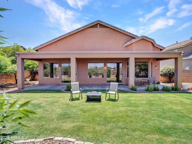 40814 N Majesty Ct, Anthem, AZ 85086 - rear view of property featuring stucco siding, a patio, and an outdoor fire pit