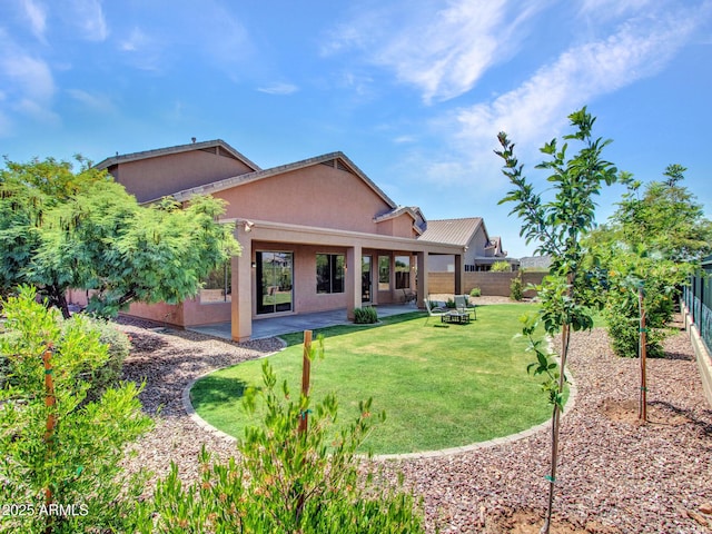40814 N Majesty Ct, Anthem, AZ 85086 - back of house with a fenced backyard, stucco siding, and a patio