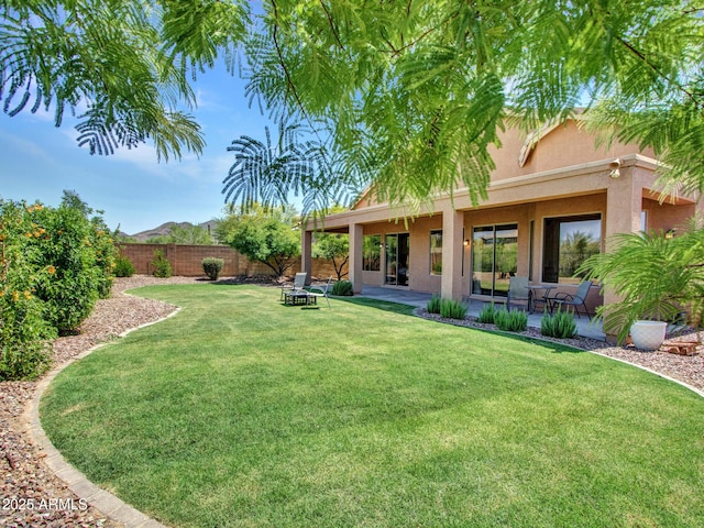 40814 N Majesty Ct, Anthem, AZ 85086 - fenced backyard with a patio and a mountain view