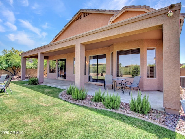 40814 N Majesty Ct, Anthem, AZ 85086 - rear view of house with stucco siding and a patio