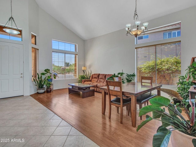 40814 N Majesty Ct, Anthem, AZ 85086 - dining room featuring high vaulted ceiling, a chandelier, and light tile patterned floors