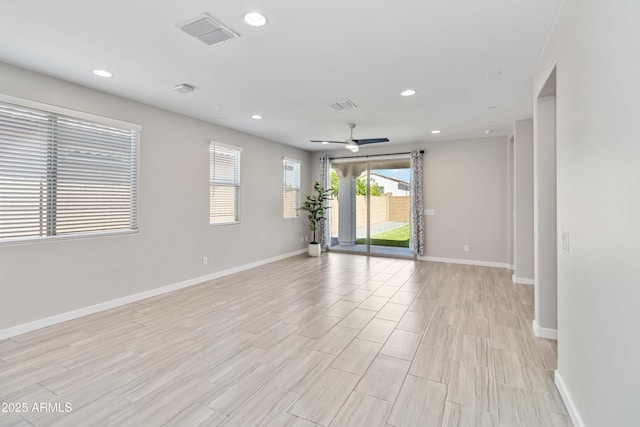 19958 W Turney Ave, Litchfield Park, AZ 85340 - spare room with visible vents, baseboards, recessed lighting, and a ceiling fan