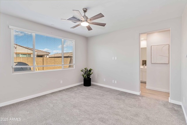 19958 W Turney Ave, Litchfield Park, AZ 85340 - carpeted spare room with baseboards and a ceiling fan