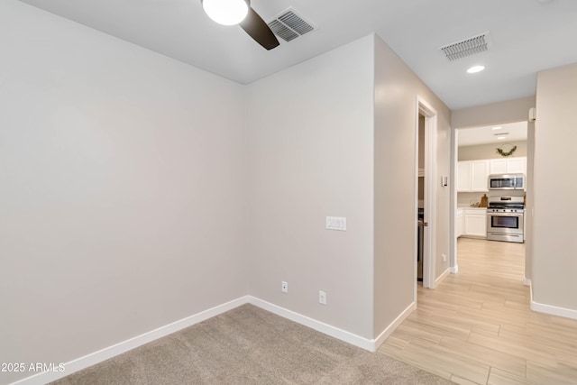 19958 W Turney Ave, Litchfield Park, AZ 85340 - spare room with baseboards, a ceiling fan, visible vents, and recessed lighting