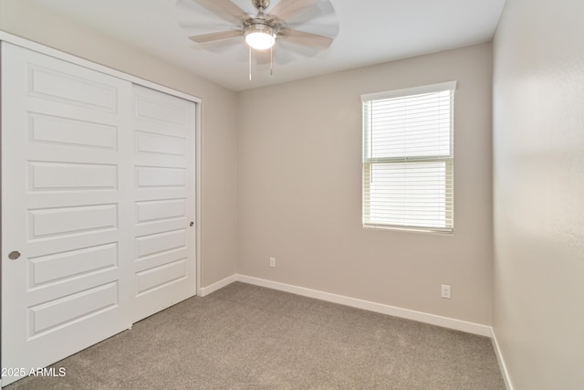 19958 W Turney Ave, Litchfield Park, AZ 85340 - unfurnished bedroom featuring a closet, ceiling fan, baseboards, and carpet floors