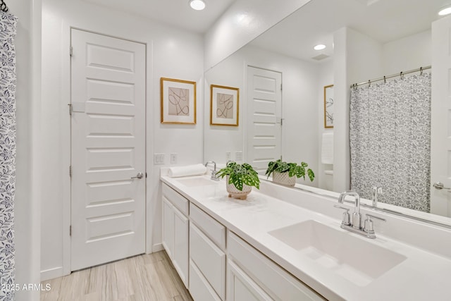 19958 W Turney Ave, Litchfield Park, AZ 85340 - full bathroom featuring a sink, double vanity, and recessed lighting