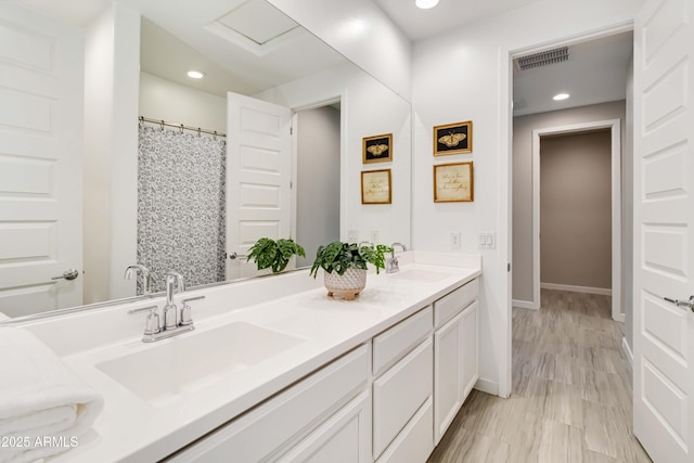 19958 W Turney Ave, Litchfield Park, AZ 85340 - full bath with double vanity, a sink, visible vents, and recessed lighting