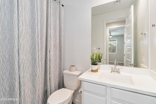 19958 W Turney Ave, Litchfield Park, AZ 85340 - bathroom with toilet, vanity, ceiling fan, and visible vents