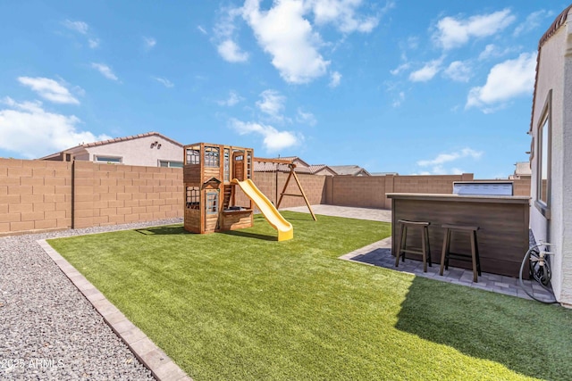 19958 W Turney Ave, Litchfield Park, AZ 85340 - view of yard with a patio area, a fenced backyard, outdoor dry bar, and a playground