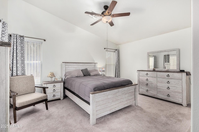 bedroom with a ceiling fan, light carpet, and high vaulted ceiling